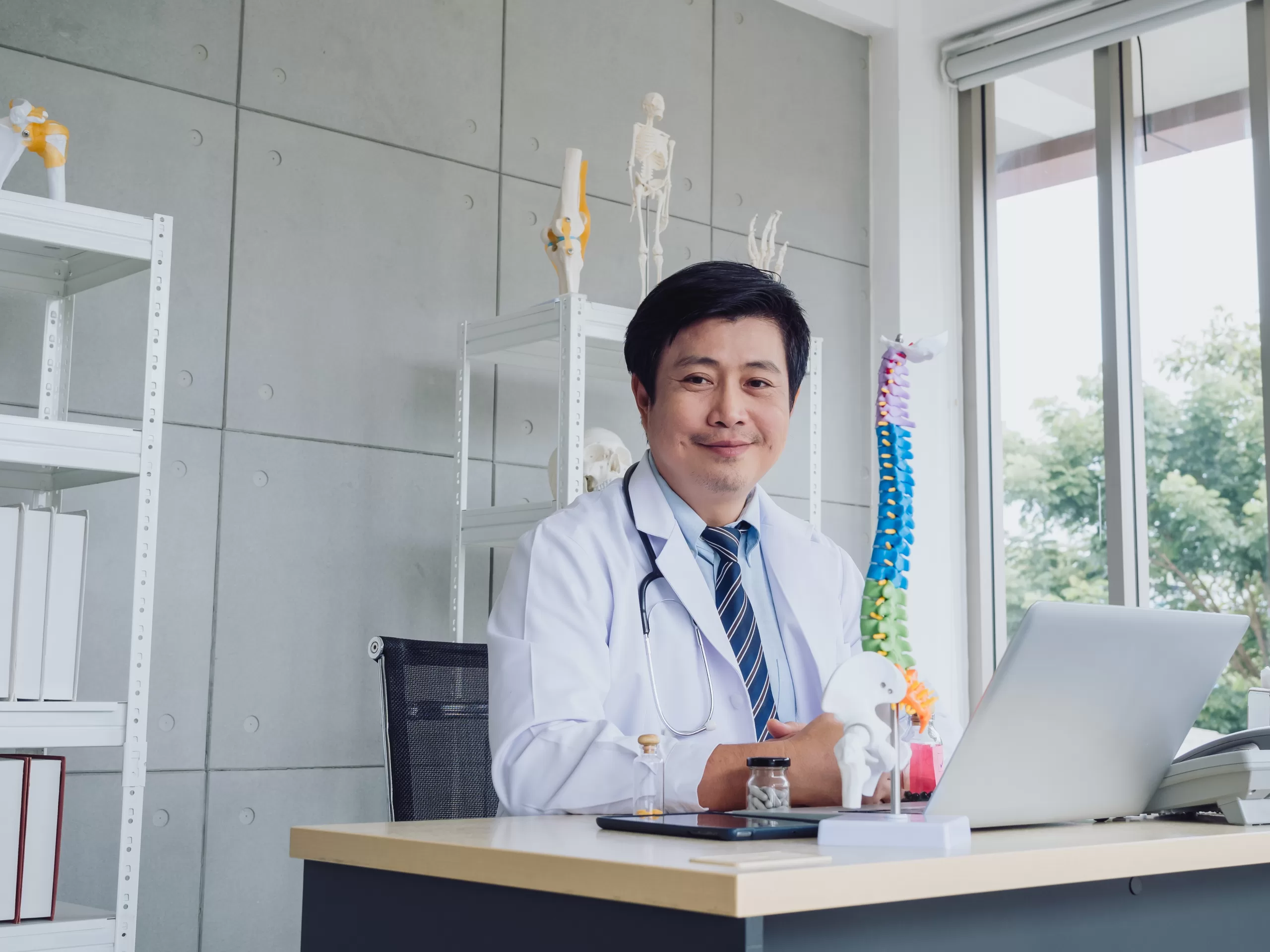 Happy,Smile,Asian,Adult,Male,Orthopedic,Doctor,In,White,Suit